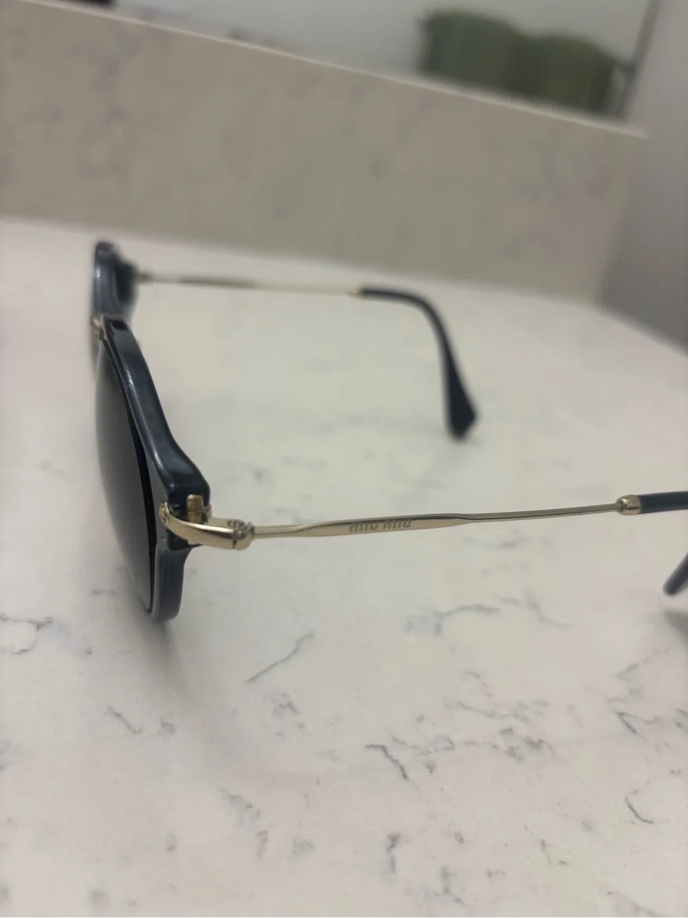 Miu Miu Black Round Sunglasses with Gold Bridge